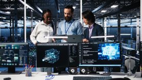 Three tech professional collaborating on a project